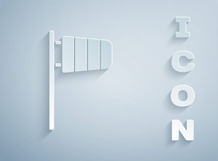 Paper cut Cone meteorology windsock wind vane icon isolated on grey background. Windsock indicate the direction and strength of the wind. Paper art style. Vectorのイラスト素材