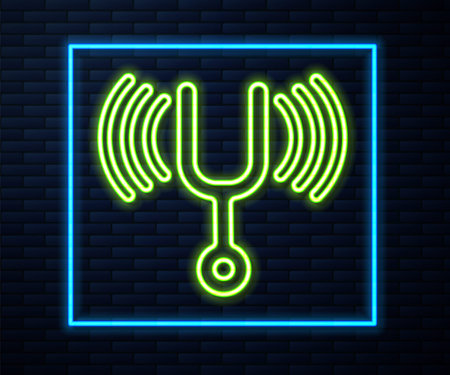 Glowing neon line Musical tuning fork for tuning musical instruments icon isolated on brick wall background. Vectorのイラスト素材