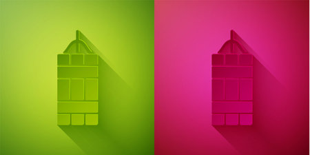 Paper cut Detonate dynamite bomb stick icon isolated on green and pink background. Time bomb - explosion danger concept. Paper art style. Vectorのイラスト素材