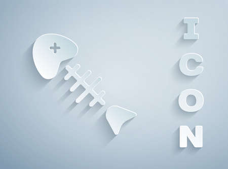Paper cut Fish skeleton icon isolated on grey background. Fish bone sign. Paper art style. Vector