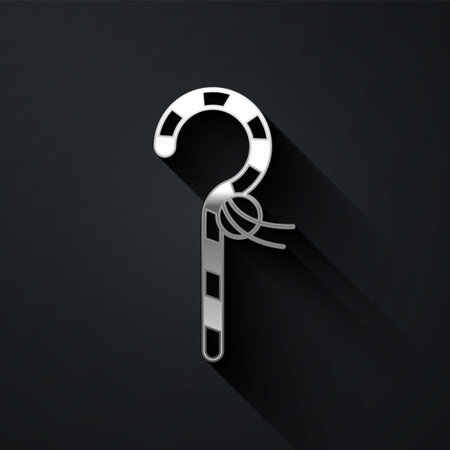 Silver Crook icon isolated on black background. Ancient Egypt symbol. Scepters of egypt. Long shadow style. Vectorのイラスト素材