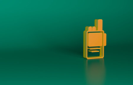Orange Walkie talkie icon isolated on green background. Portable radio transmitter icon. Radio transceiver sign. Minimalism concept. 3D render illustrationの写真素材