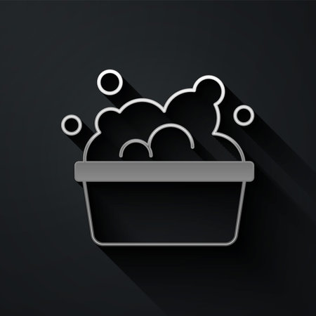 Silver Plastic basin with soap suds icon isolated on black background. Bowl with water. Washing clothes, cleaning equipment. Long shadow style. Vectorのイラスト素材