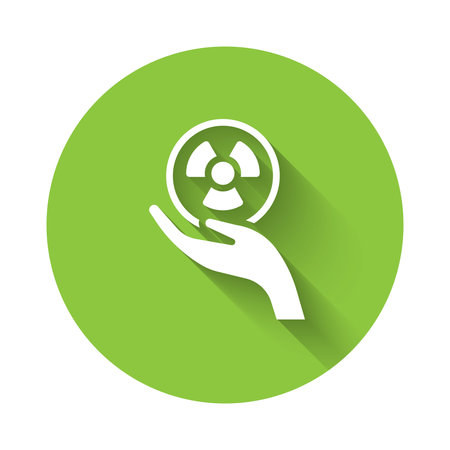 White Radioactive in hand icon isolated with long shadow background. Radioactive toxic symbol. Radiation Hazard sign. Green circle button. Vector.のイラスト素材