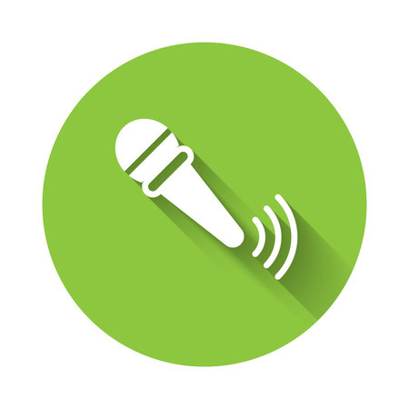 White Wireless microphone icon isolated with long shadow background. On air radio mic microphone. Speaker sign. Green circle button. Vector.のイラスト素材