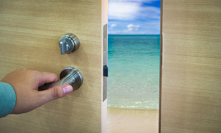 Open door in a beach with ocean and waves, conceptの写真素材