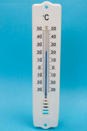 Thermometer against blue background with blue mercuryの写真素材