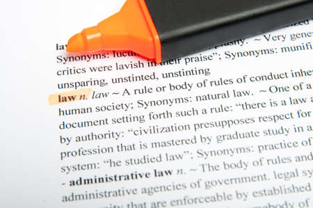 Translation of the word law in the dictionary with highlight markerの写真素材