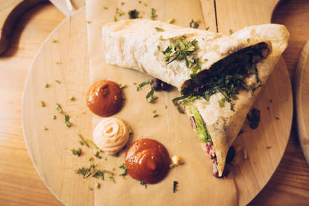 Breakfast wraps with vegetables and spicy mexican salsa dipsの写真素材