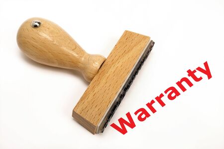 rubber stamp marked with warrantyの写真素材
