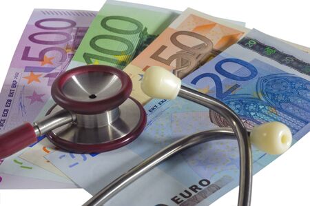 medical stethoscope and euro banknotesの写真素材