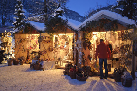  ETTAL, BAVARIA, GERMANY - DECEMBER 4: The traditional annual christmas market with illuminated shops at night in famous 700 years old benedictine abbey Ettal, nearby city Oberammergau and Garmisch, December 4, 2010 in Ettal, Germanyのeditorial素材