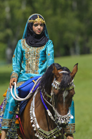 MUNICH, GERMANY - JUNE 4:  female member of the arabian -Royal Cavalry of Oman- while a public show at the equestrian challenge -Pferd International 2011-, at June 4, 2011 in Munich, Germanyのeditorial素材