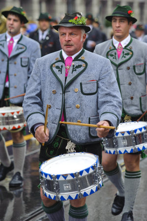 MUNICH, GERMANY - September 18:  public opening parade of world biggest beer folk festival oktoberfest in munich with 9000 performers and music band, at September 18, 2011 in Munich, Germanyのeditorial素材