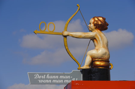 MUNICH, GERMANY - SEPTEMBER 21: figure with arrow shows the way to toilet at world biggest beer festival -Oktoberfest in Munich- on September  21, 2011 in Munich, Germanyのeditorial素材