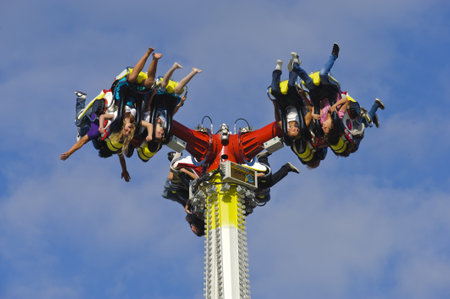 MUNICH, GERMANY - SEPTEMBER 21: carousel with flying people at world biggest beer festival...