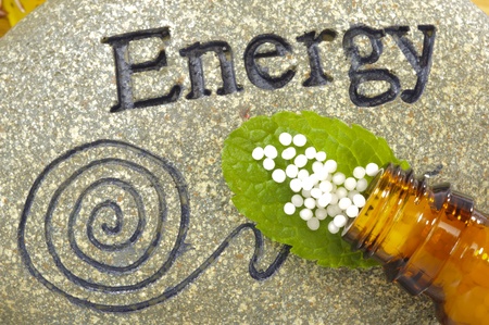 homeopathic globules on stone of energyの写真素材