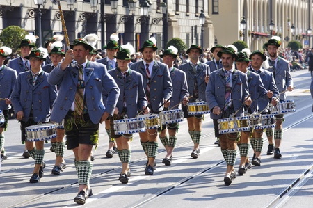 MUNICH, GERMANY - SEPTEMBER 23: a music drum band in traditional bavarian clothes participates in...