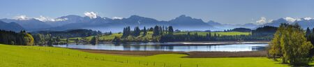 panorama view over beautiful rural landscape nearby city Fuessen in Bavaria, Germanyの写真素材