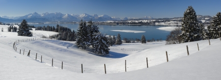 panorama landscape in bavaria with lake and alps mountains at winterの写真素材