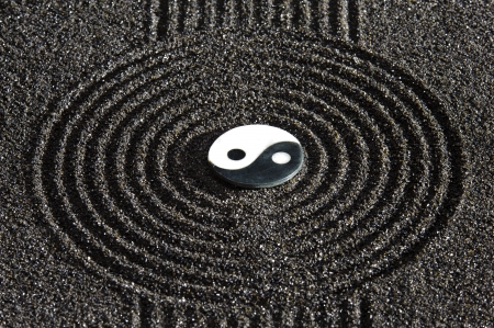 Japanese ZEN garden with stone of yin and yang  in raked sandの写真素材
