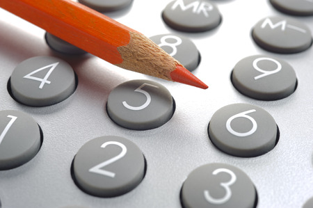 red pencil on financial calculator