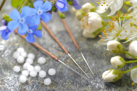 alternative medicine with herbal pills and acupunctureの写真素材