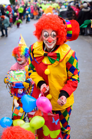 public carnival parade with colorful costumes at city Bad Hindelang in Bavaria, Germanyのeditorial素材