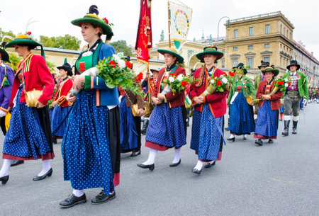 Munich, Germany -  September 20, 2015: The Oktoberfest is the world biggest beer festival and at the opening parade with rd. 9000 participants take part in historical costumes, music bands and horses.のeditorial素材