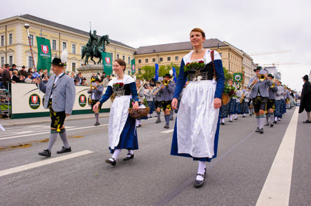 Munich, Germany -  September 20, 2015:  The Oktoberfest is the world biggest beer festival and at the opening parade with rd. 9000 participants take part in historical costumes, music bands and horses.のeditorial素材
