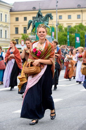 Munich, Germany -  September 20, 2015:  The Oktoberfest is the world biggest beer festival and at the opening parade with rd. 9000 participants take part in historical costumes, music bands and horses.のeditorial素材