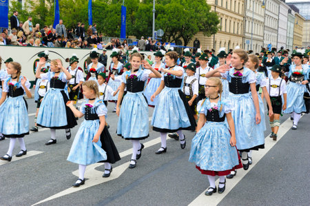 Munich, Germany -  September 20, 2015: The Oktoberfest is the world biggest beer festival and at the opening parade with rd. 9000 participants take part with historical costumes, music bands and horsesのeditorial素材