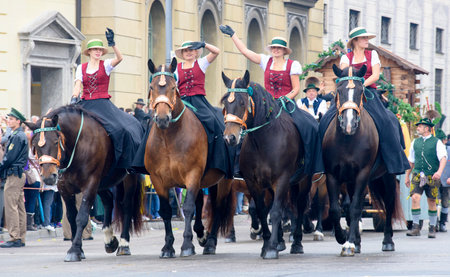 Munich, Germany -  September 20, 2015: The Oktoberfest is the world biggest beer festival and at the opening parade with rd. 9000 participants take part with historical costumes, music bands and horsesのeditorial素材