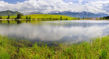panorama landscape in Bavaria with lake and meadowの写真素材