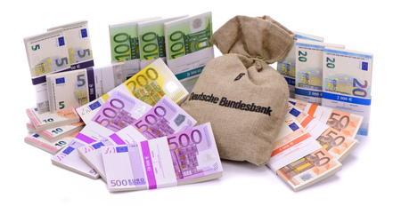 many Euro banknotes as group with sack of german bank laying on tableの写真素材