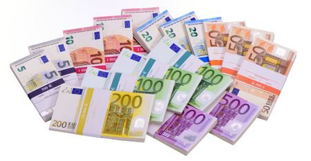 many Euro banknotes as group laying on tableの写真素材