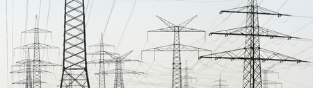 panorama of many electric pylons for power supplyの写真素材
