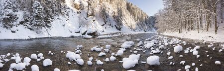panorama scene with ice and snow at river in Bavaria, Germanyの写真素材