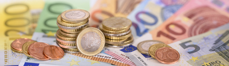 panorama still of Euro  banknotes and coins of european currencyの写真素材