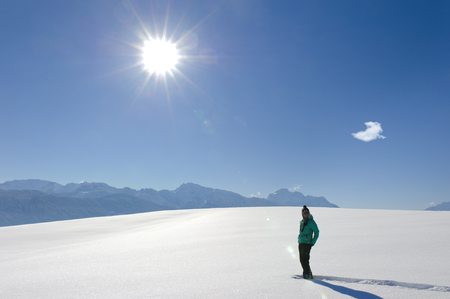 female hiker in fresh powder snowの写真素材