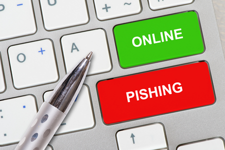 online pishing printed on computer keyboard