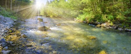 panoramic landscape with river in the mountainsの写真素材