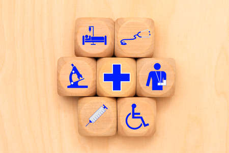 Medical care as a symbol on wooden cubesの写真素材