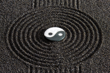 Japanese zen garden with stone in textured sandの写真素材