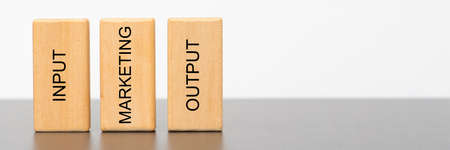 marketing, input and output printed on wooden cubesの写真素材