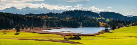 panoramic landscape with mountain range in Bavaria at springtimeの写真素材