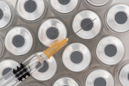 original vials with vaccine against covid-19 virusのeditorial素材