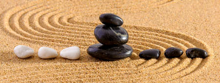 Japanese ZEN garden with yin yang stone in textured sandの写真素材