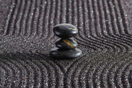 Japanese ZEN garden with yin yang stone in textured sandの写真素材