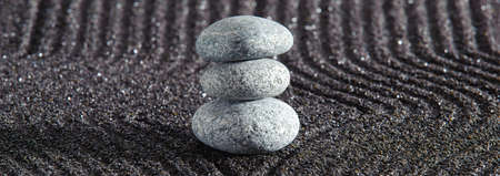 Japanese ZEN garden with yin yang stone in textured sandの写真素材